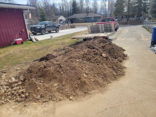 Piles of dirt left behind that he should have taken care of