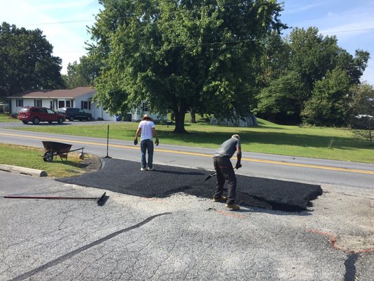 Asphalt patching , Resurfacing of low area