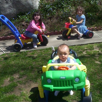 Fenced in play area with a "car track" for the children.