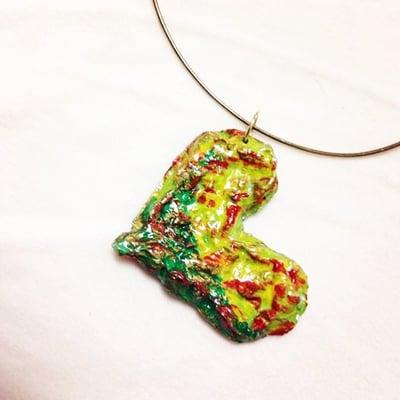 Trash As Art heart shaped necklace handmade from newspaper and painted with acrylic paints.