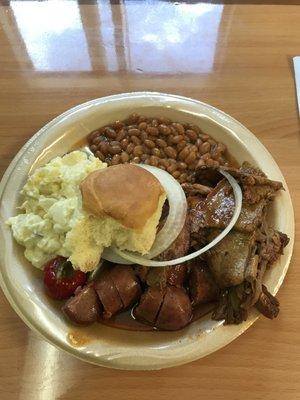 Two meet plate, sliced brisket and a Zummo sausage. The two sides that came with it were baked beans and potato salad.