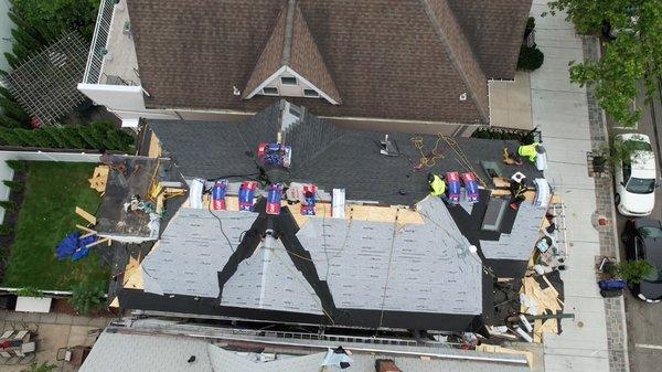 Workers completing the roof.