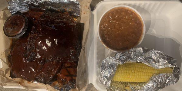 Ribs and brisket with bbq beans and cobbed corn.