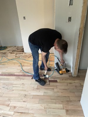 Install new unfinished hardwood nailed down flooring