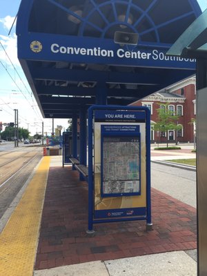 A view of the platform and small covered waiting area.