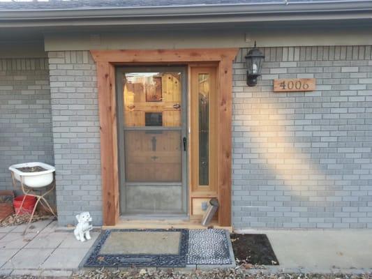 Installed client's existing door in what was just a brick wall. We built and added the side lite to the original door, also t...