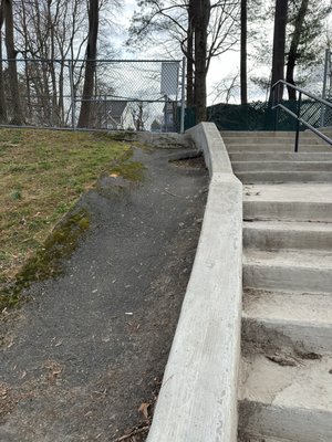 Stairs and ramp many use on side to bring down strollers