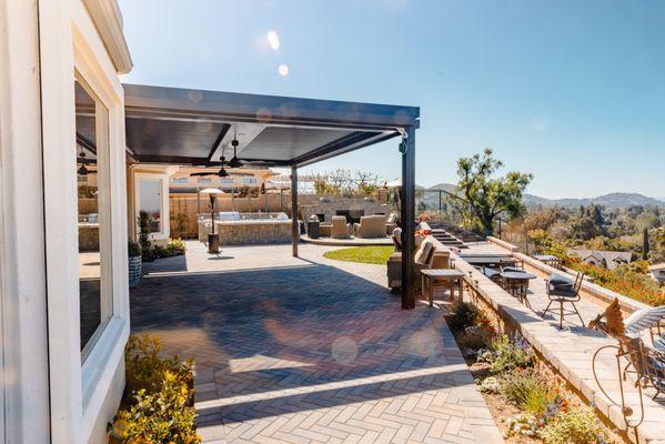 Struxure louvered patio cover with heaters, new paver patio and low voltage lighting.