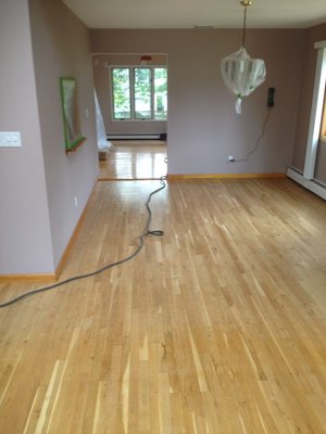 Refinished natural wood floor with satin poly