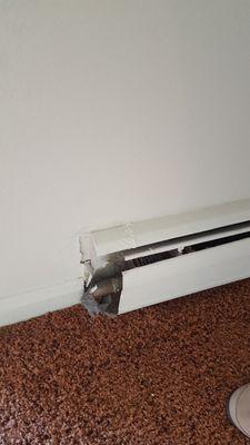 Exposed baseboard heater.