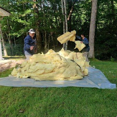 Crew working on removing insulation.