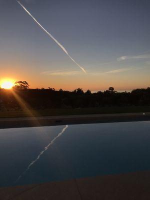 Sunrise reflection off the pool's surface