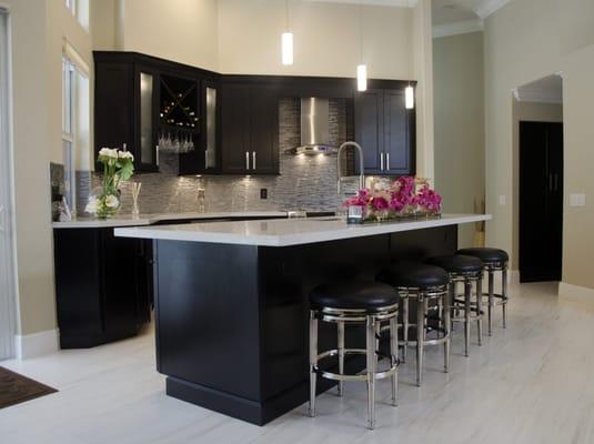 Kitchen renovation featuring Waypoint Cabinets in Maple Espresso and contrasting Quartz Counters in Snow.