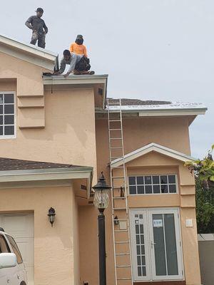 Some of workers evaluating this roof