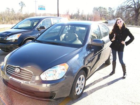 One of our many happy customers picking up her vehicle.