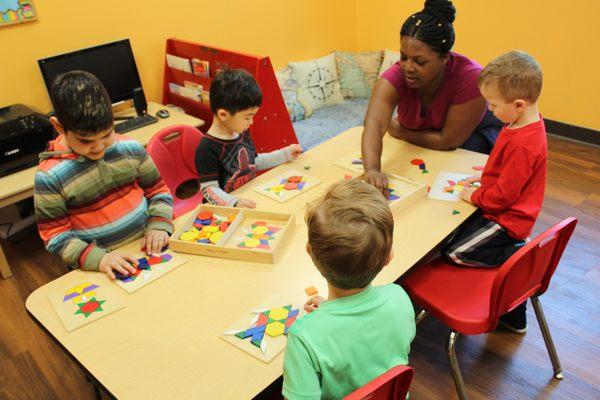 How does Preschool 2 use shapes creatively? Good time to observe the picture, focus, make choices, share stones, re-arrange - create!