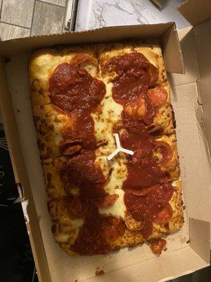 This is the garbage that we received. This is supposed to be double pepperoni Detroit style. Cheese to the edge my you know what!