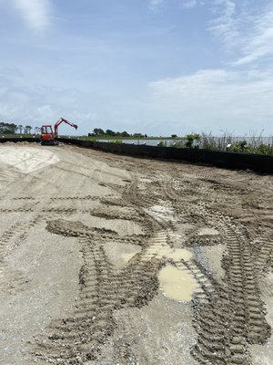 Silt fence installation in preparation for a lagoon to be dredged.