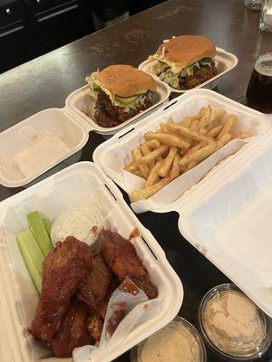 Wings, fries, crispy chicken and Nashville hot chicken sandwiches. Aioli in the foreground. Delicious!