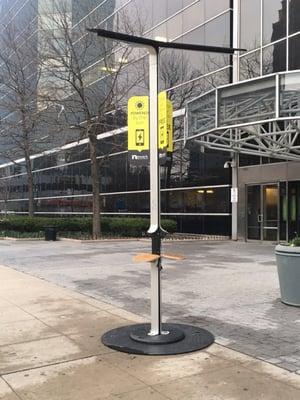 Solar-powered, mobile device charging station outside of the Mulberry Street entrance