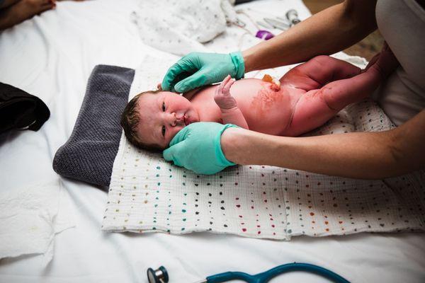 Jocelyn performing newborn exam