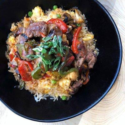 Needs More Cow Bowl! Teriyaki filet, cauliflower, portobello, peppers & scallion over egg fried rice. #LiveHappy