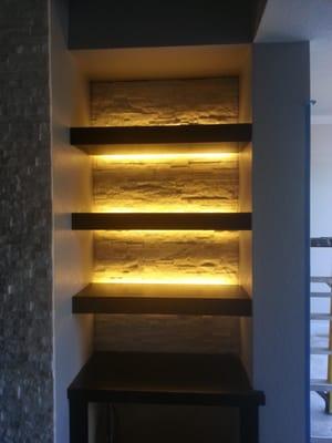 LED tape light's recessed in shelving