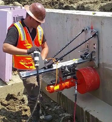 Core drilling a concrete wall on school project in Minot, ND