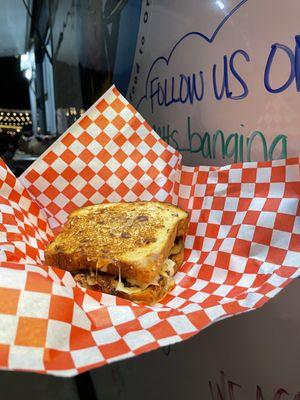 Sweet n' savory fresh baked Dutch apple bread grilled cheese with smoked pulled pork and grilled onions