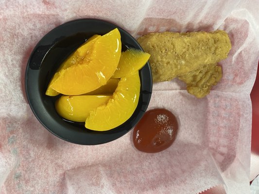 Kids chicken tenders and fruit.