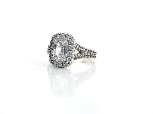 Cushion shape diamond halo ring.