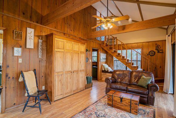 The tall wood wall gives the Treehouse cabin a natural feel and a sense of being truly surrounded by trees.