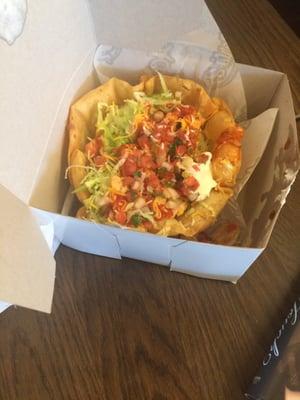 Chicken taco salad. Looks like a box they use at bakeries for small cakes.