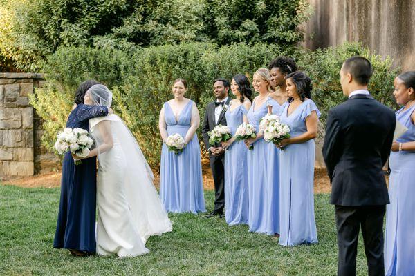 Floor-length bridesmaids dresses in periwinkle and lux chiffon by Bella Bridesmaids. Photo by Leigh Wolfe Photography.