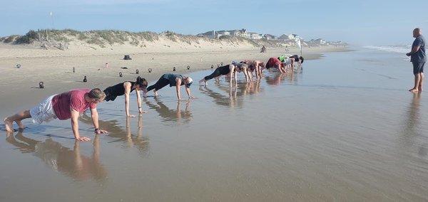 Planking at the water's edge.