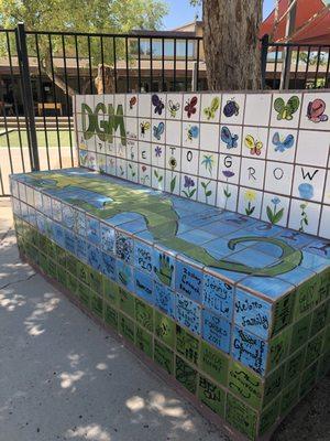 Our well-loved bench that was designed by the children. Featuring our DGM Gila Monster mascot.