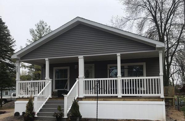 Large covered porch, open floor plan with large island kitchen, 3 bedroom and 2 bath.