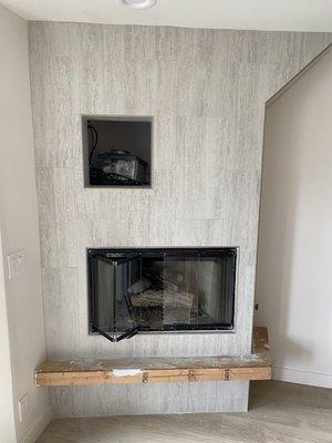 This fireplace was just Sheetrock with a basic finish. If you notice the custom tile with schluter edging.