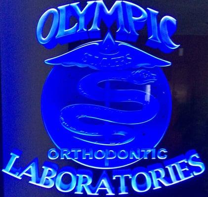 Olympic Orthodontic Laboratories Logo