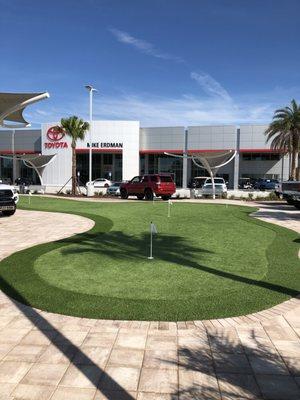 No more sitting around waiting at the dealership, at the new Mike Erdman Toyota & Nissan, you can putt around on their new putting greens!