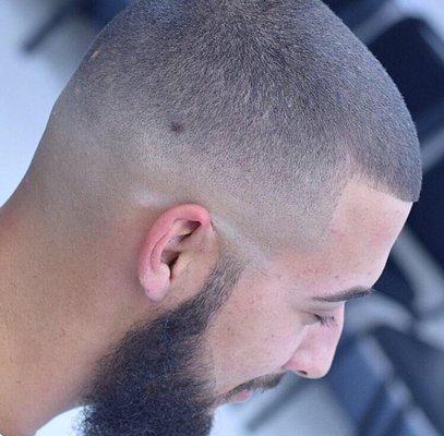 Skin tight fade with a natural beard