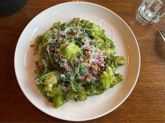 Gnocchi Special with pea sprouts, English peas, romanesco, parmesan, and crispy prosciutto