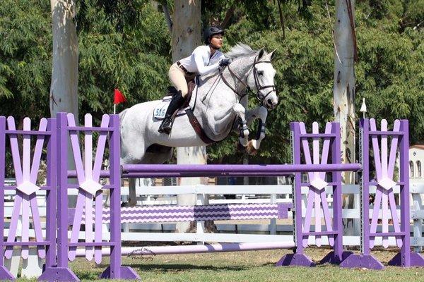 Trainer/Owner Courtney Welch riding in competition