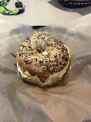 Everything bagel sandwich with american cheese bacon and egg! I added scallion cream cheese to both sides of the bagel.