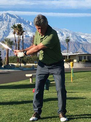 Golfer on first tee with Mount San Jacinto in background