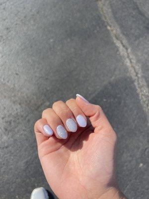 Lovely lavender acrylics with a sparkly gel over two nails