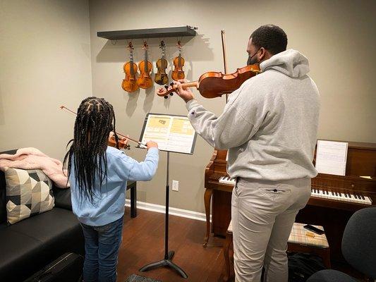 Mr. Brian working with one of his students.