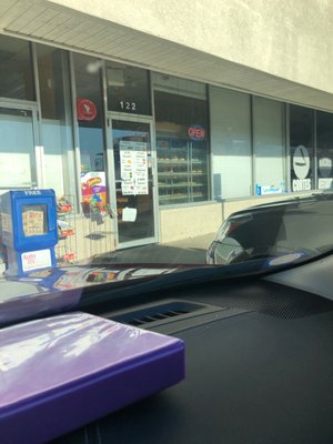 Store front with open sign on, during business hours but doors locked. Smh!