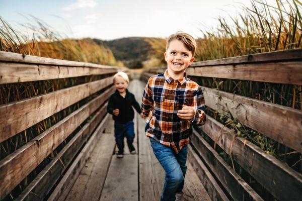 2 boys running through the marina in martinez