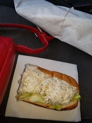 Chicken salad sandwich with lettuce onions salt & pepper